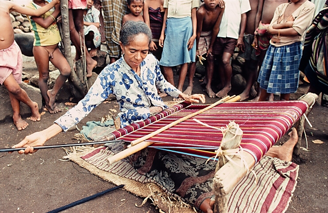Woman weaving ikat sarong on Alor