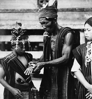 Batak family in formal ikat attire during Gale Gale ceremony